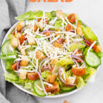 Photo of a house salad with the words house salad