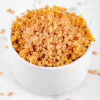 Square photo of a bowl of cooked millet
