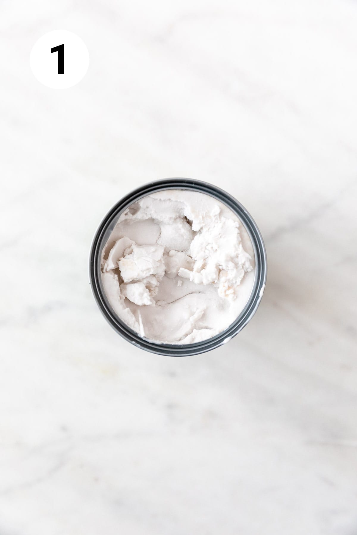 Opened can of full-fat coconut milk.