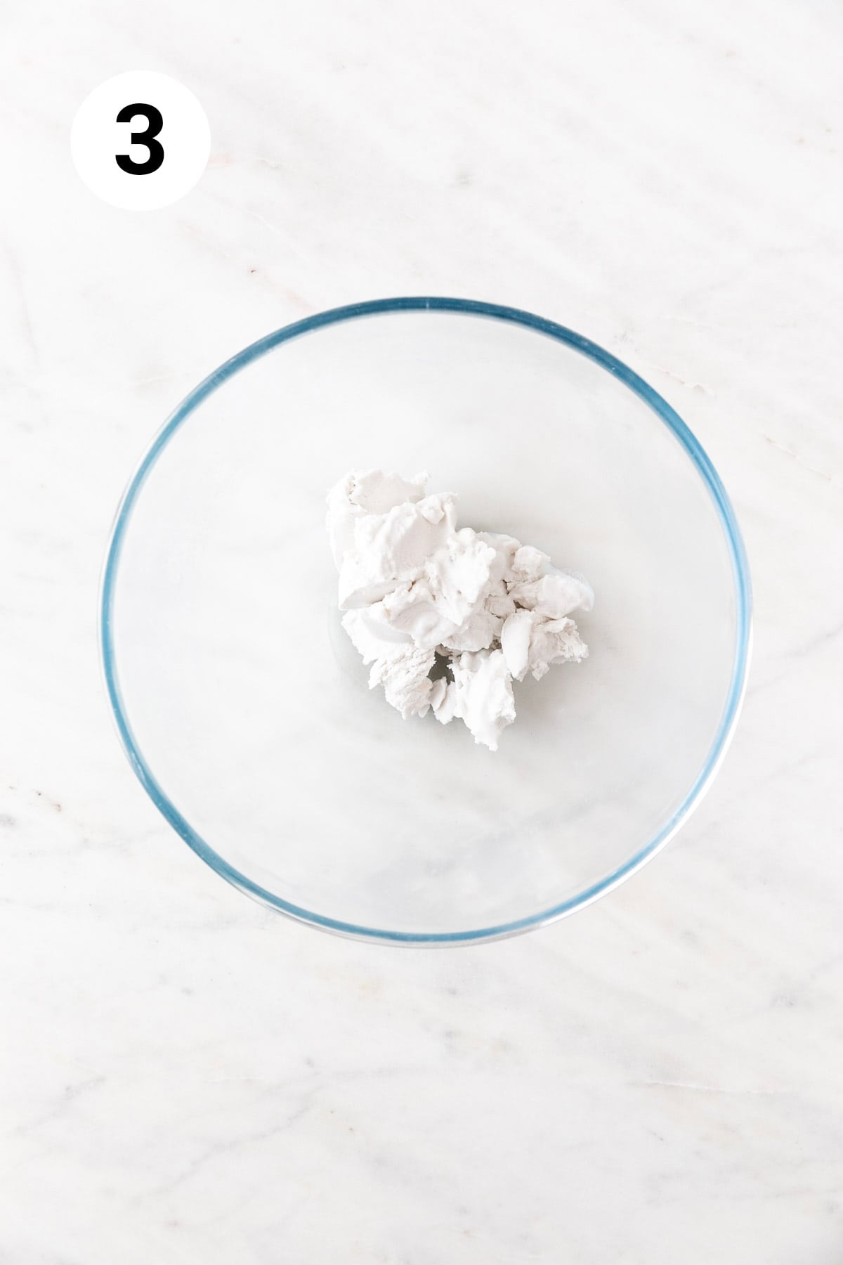 Coconut cream solids in a large mixing bowl.