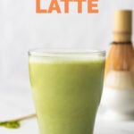 Side shot of a cup of matcha latte with the words matcha latte