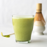 Square photo of a cup of matcha latte