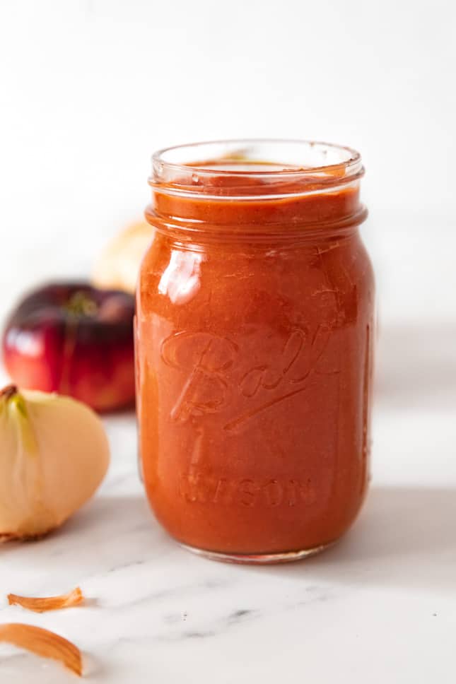Side shot of a glass jar of pizza sauce