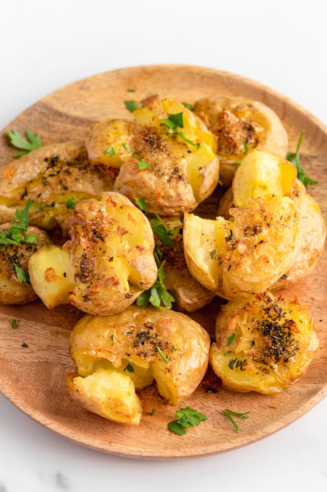 Photo of a plate of crispy smashed potatoes