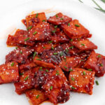 Photo of a plate of spicy tofu with a title