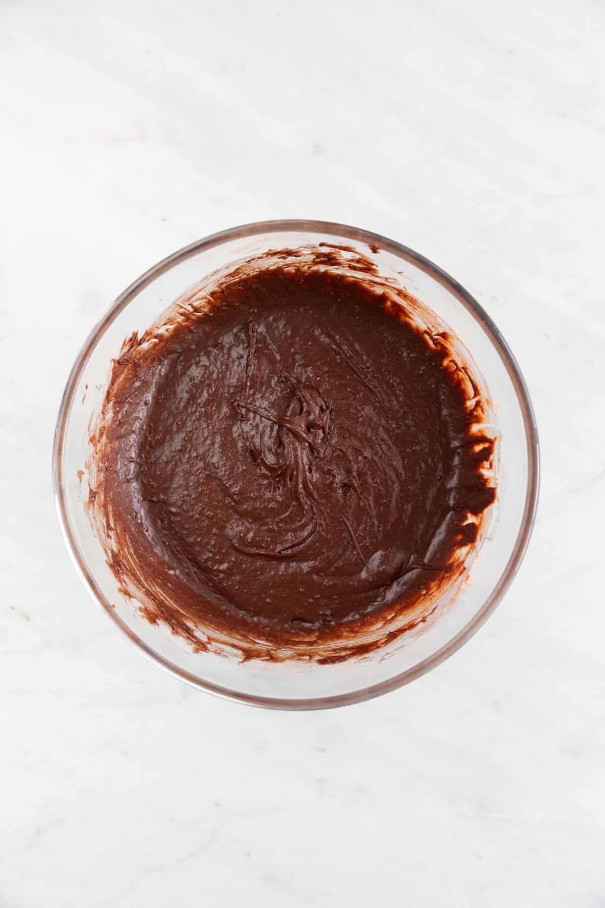 Vegan brownie batter in a large bowl.