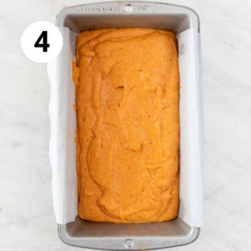 Vegan pumpkin bread batter in the lined loaf pan.