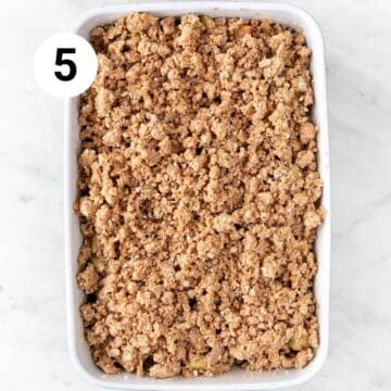 Baking dish with vegan apple crisp before baking.
