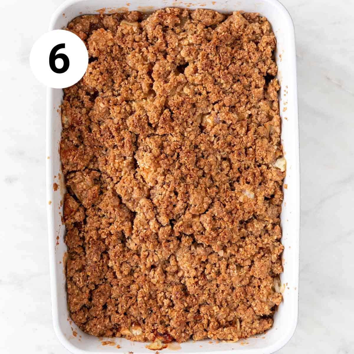 Baking dish with vegan apple crisp after baking.