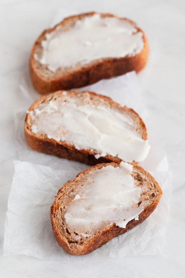 Photo of some vegan butter spread onto some slices of bread
