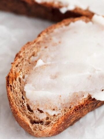 Photo of some vegan butter spread onto a slice of bread
