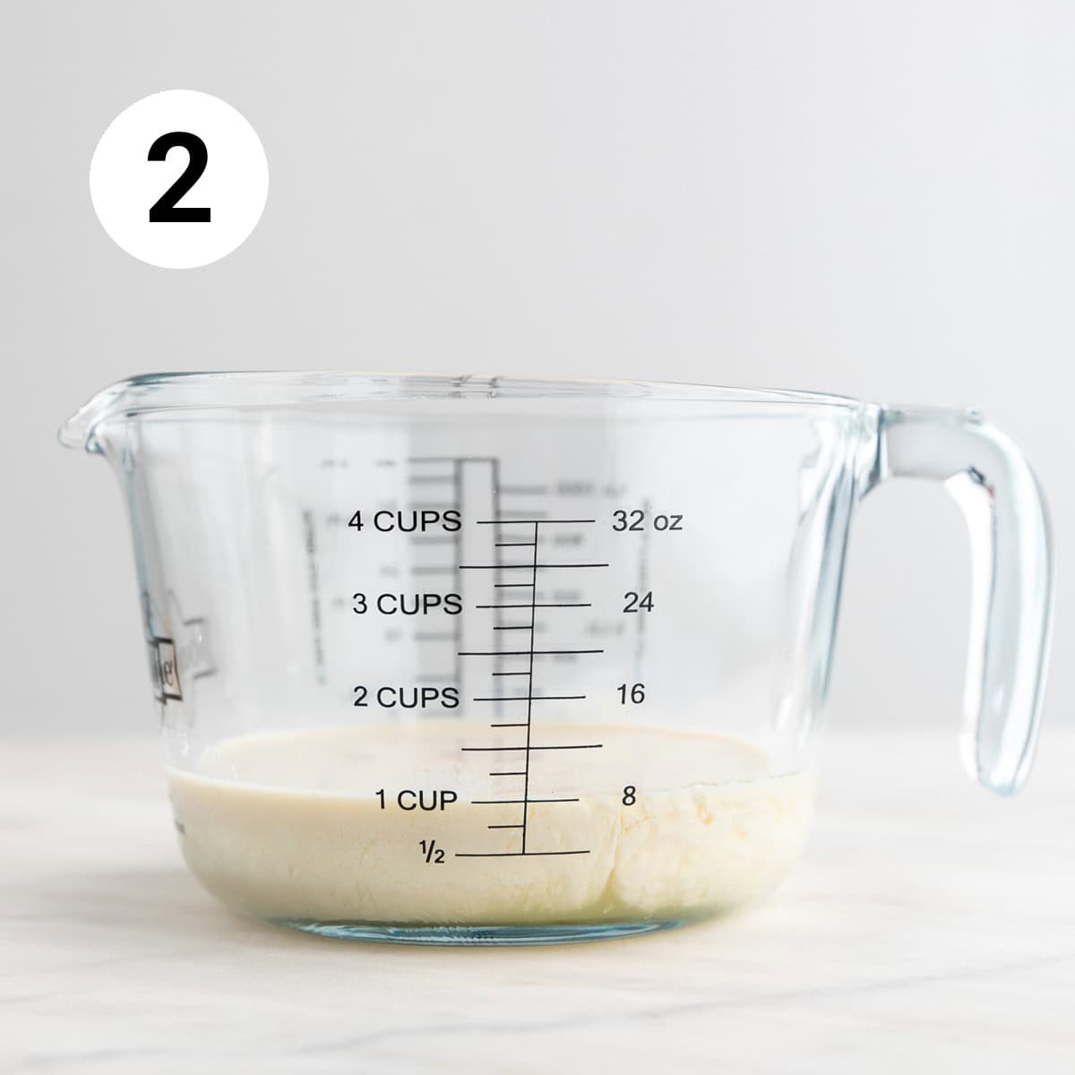 Measuring jar with vegan buttermilk.