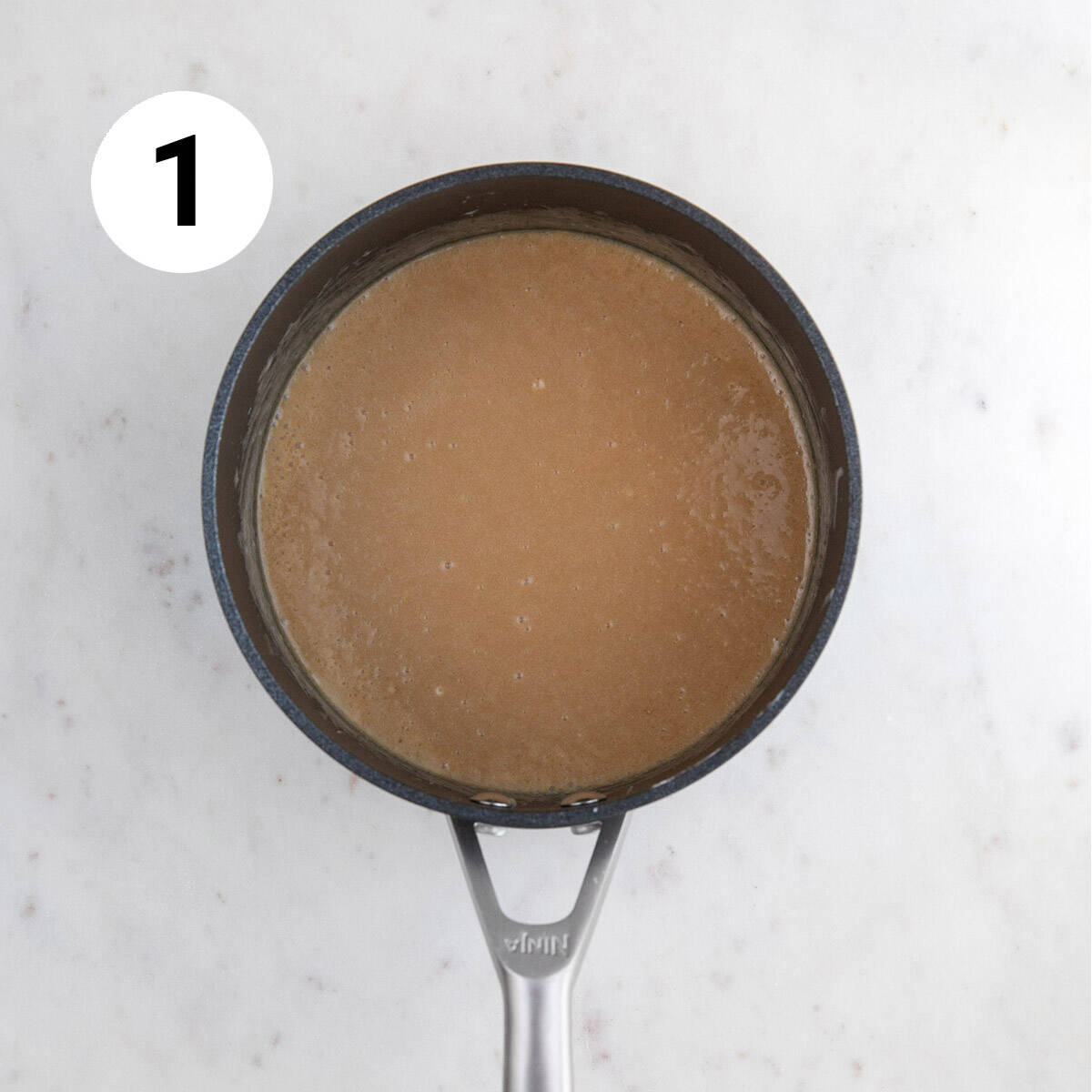 Saucepan with mixed ingredients before cooking.