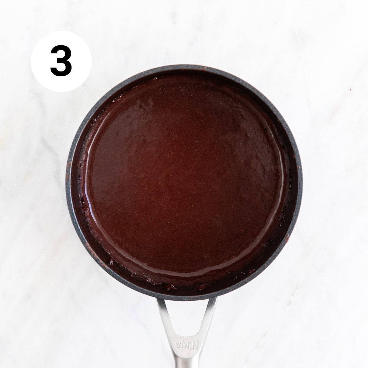 Cooked vegan chocolate pudding in a saucepan.