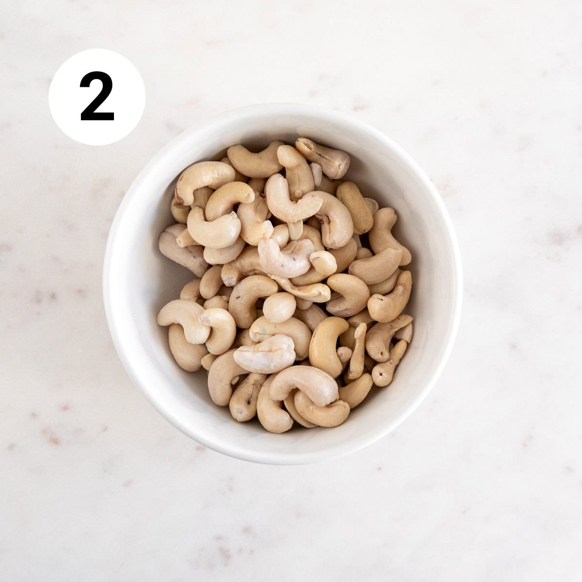 Drained and rinsed cashews in a bowl.