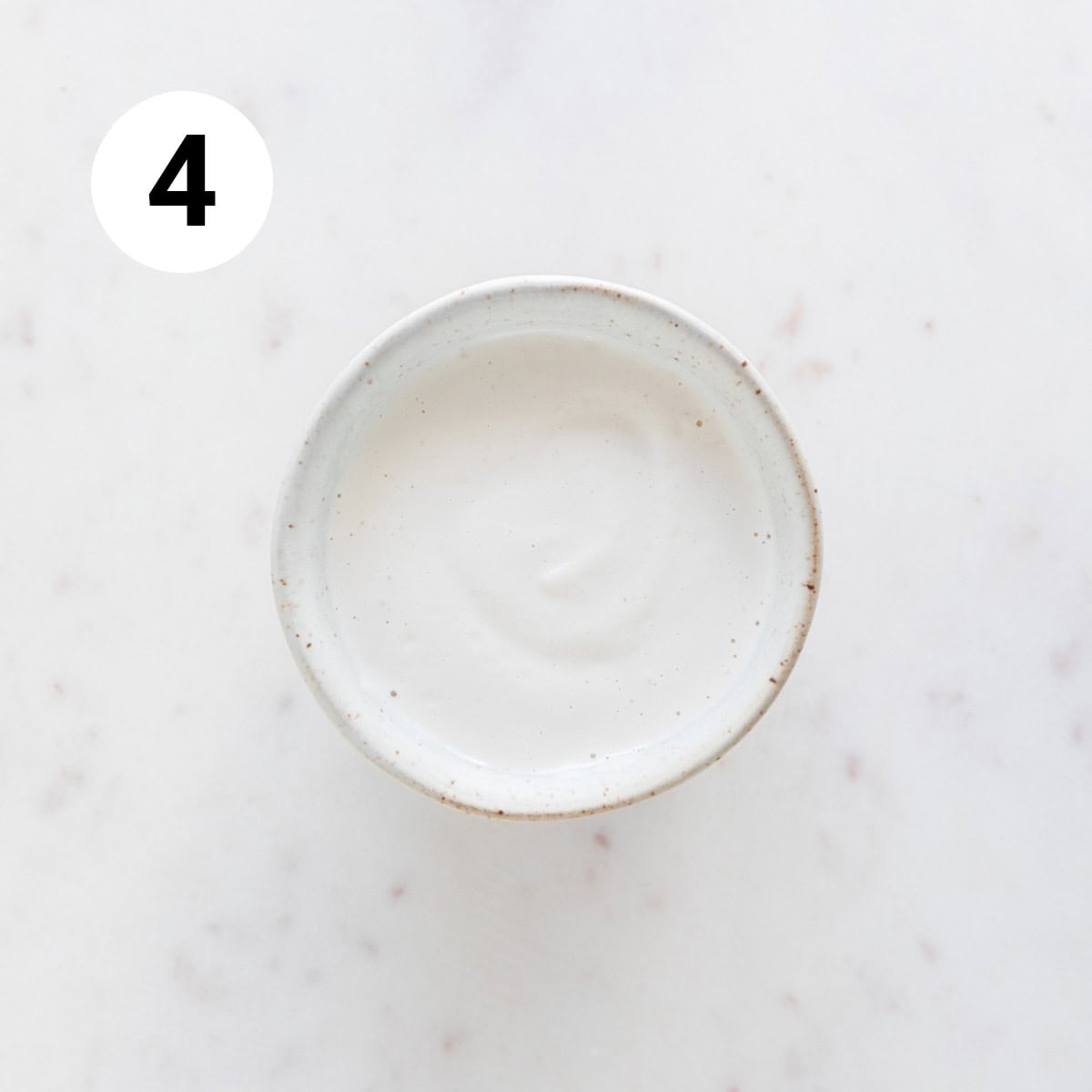 Vegan heavy cream substitute in a small bowl.