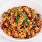 A square picture of a dish of vegan jambalaya