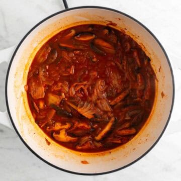 Vegan kimchi stew in a large pot before adding the tofu.