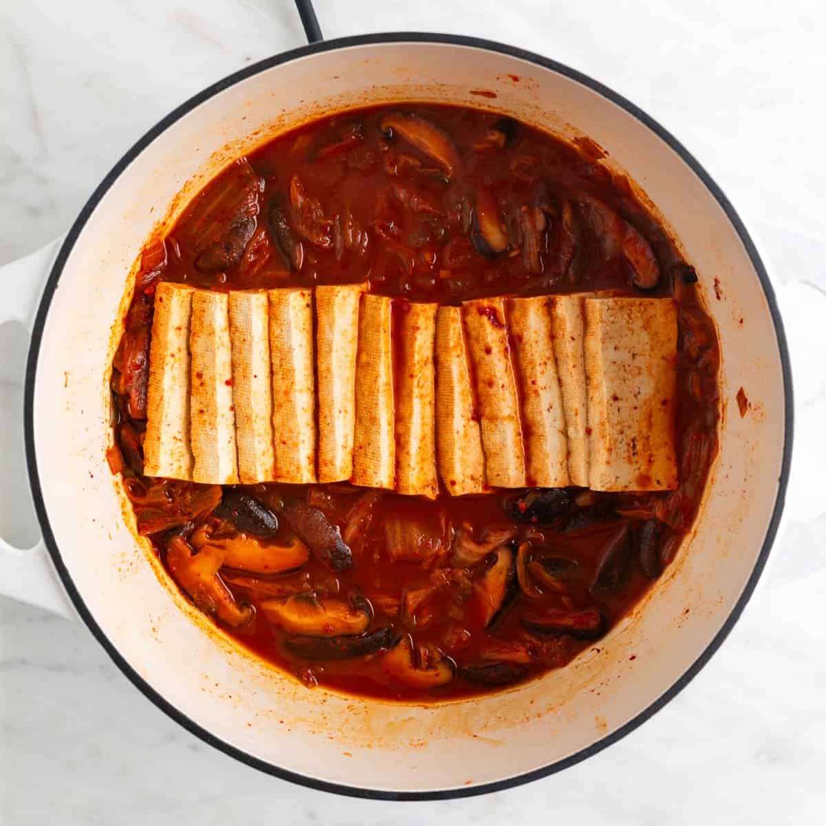 Vegan kimchi stew in a large pot.