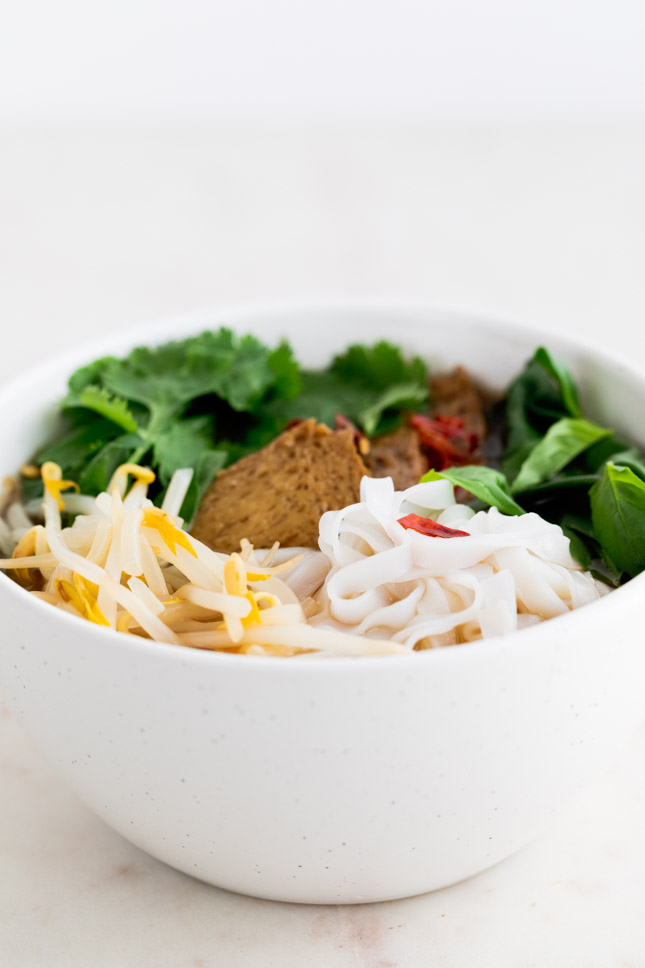 A side shot of a bowl with vegan pho made from scratch