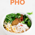 A picture of a bowl with homemade vegan pho with the words vegan pho