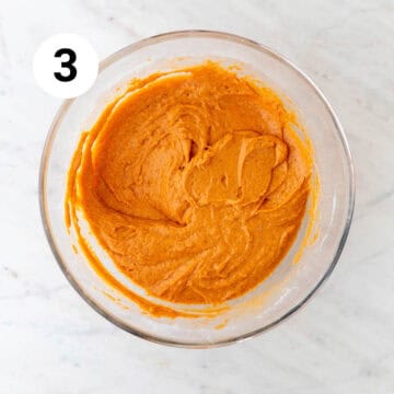 Vegan pumpkin muffin batter in a large mixing bowl.