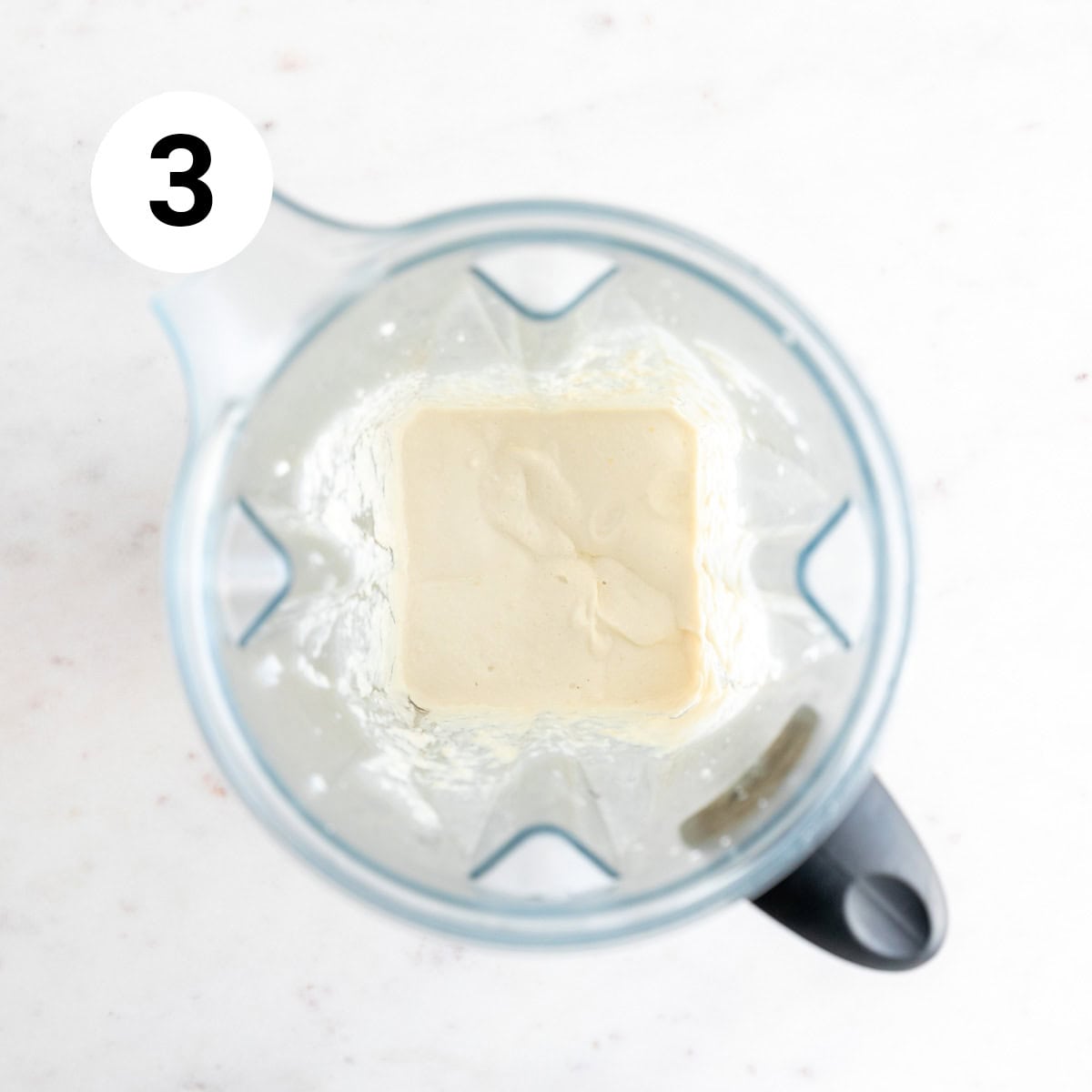 Vegan sour cream in a blender jar.