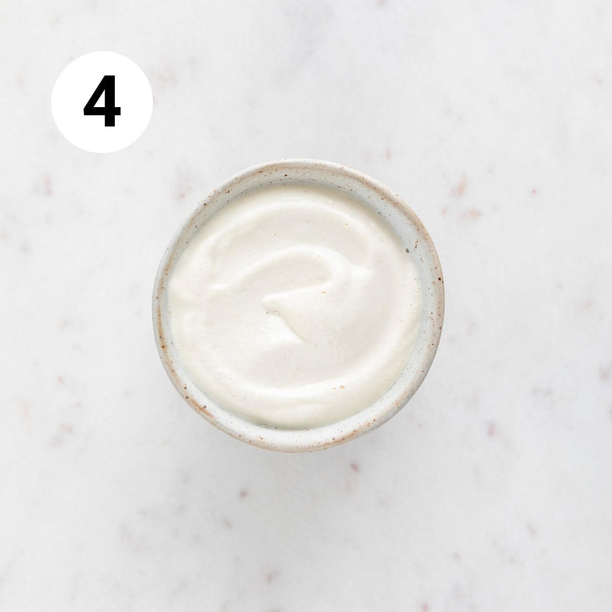 Vegan sour cream in a small bowl.