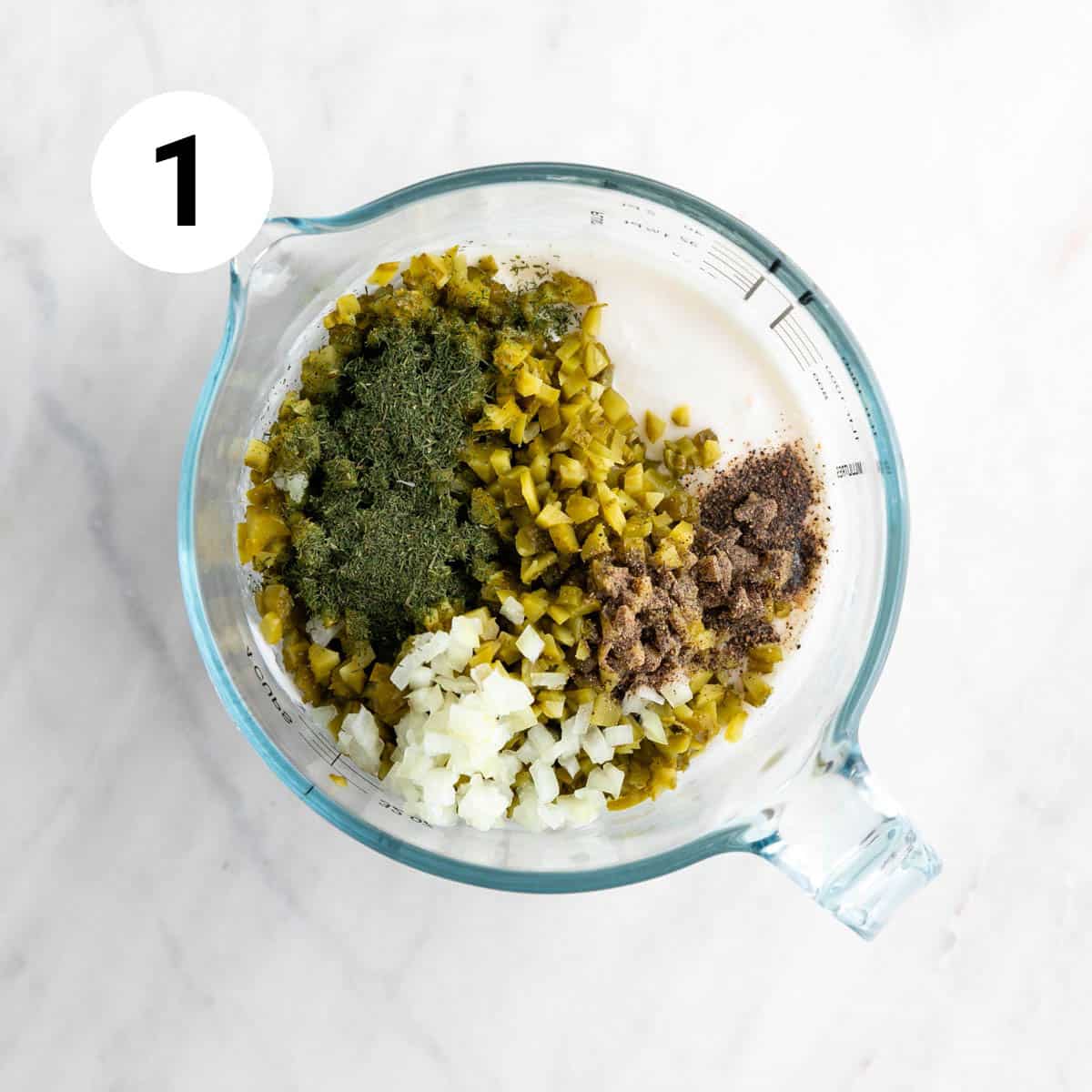 Measuring cup with the ingredients before whisking.